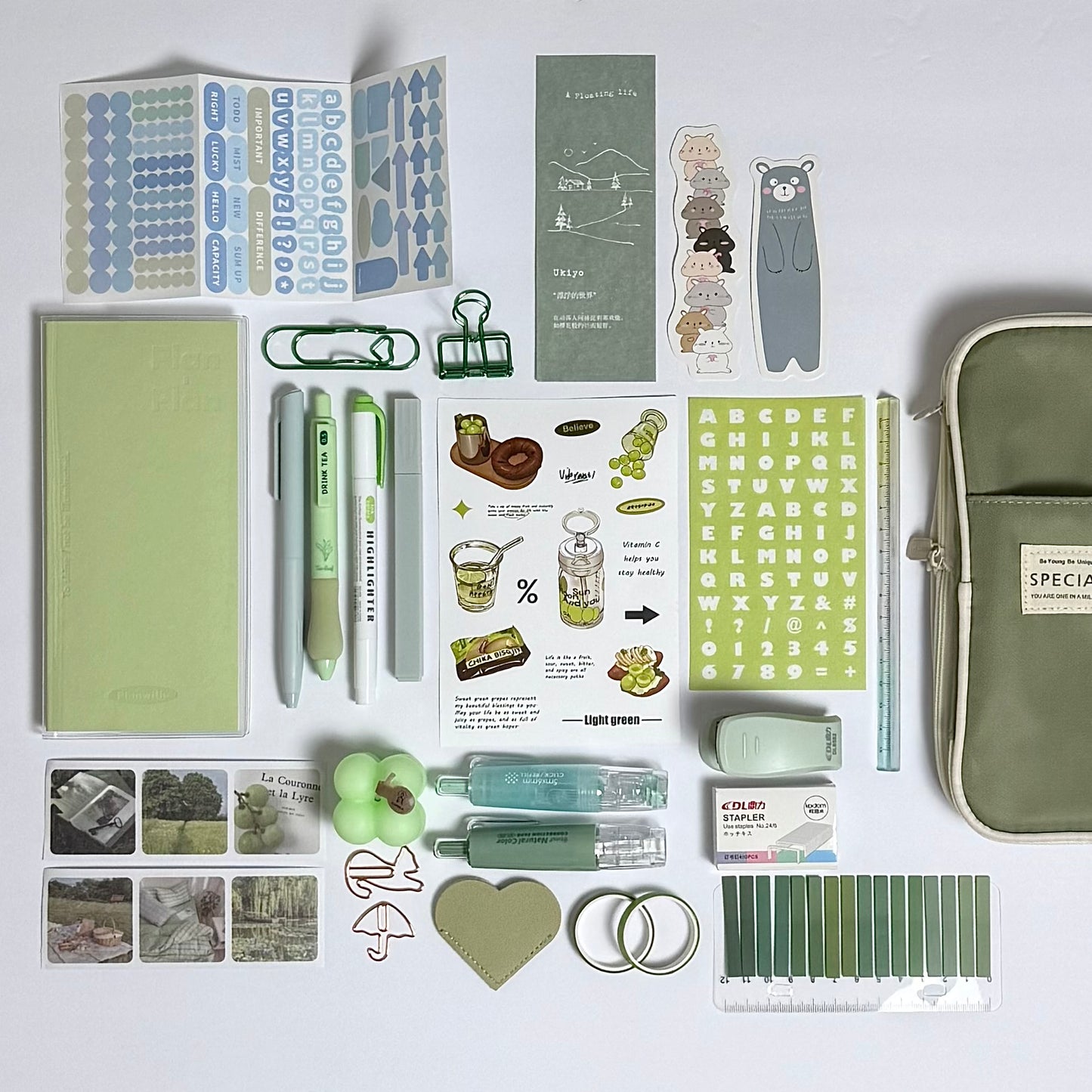 Green planner and journaling stationery set for planning and organization