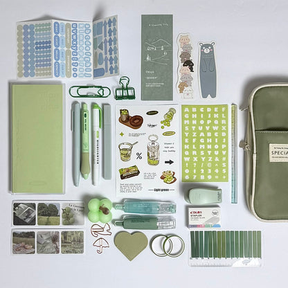 Green planner and journaling stationery set for planning and organization