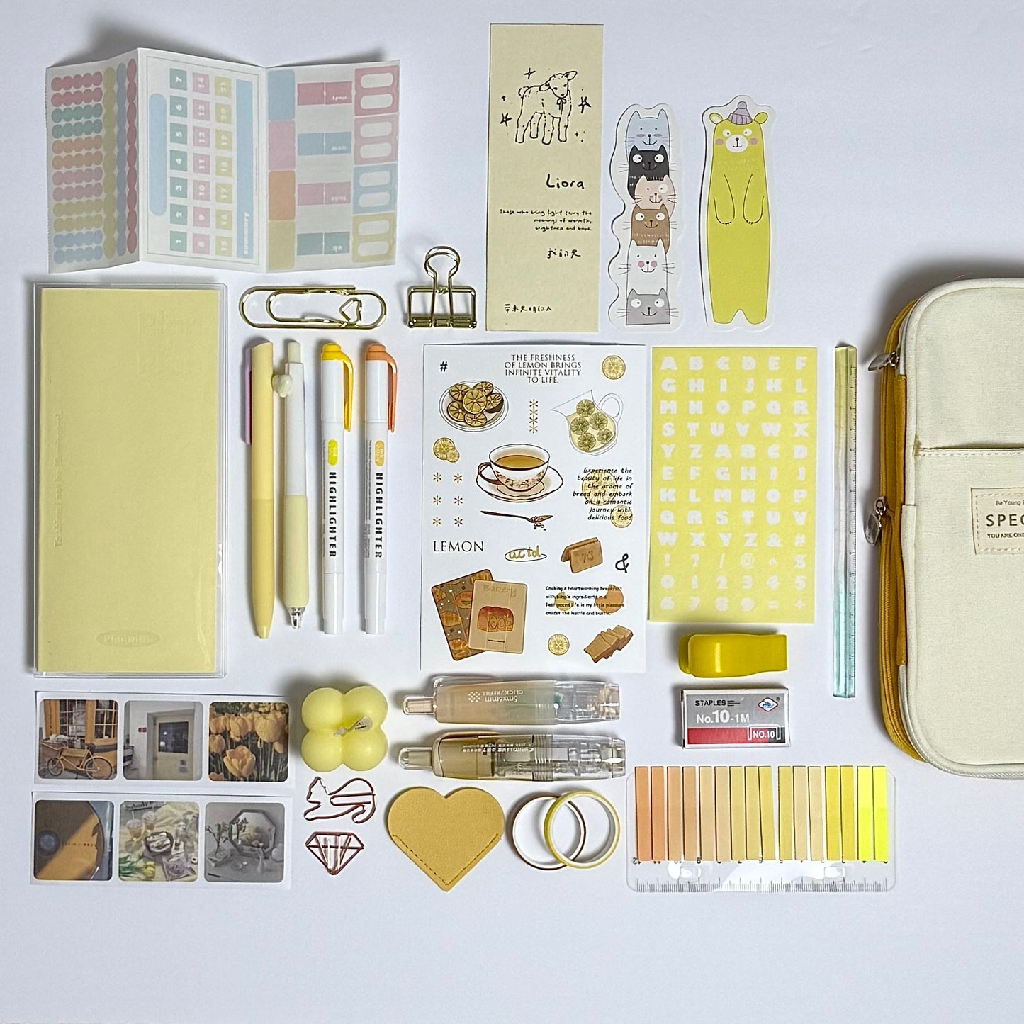 Yellow aesthetic planner and stationery set with journal, pens, stickers and pencil case
