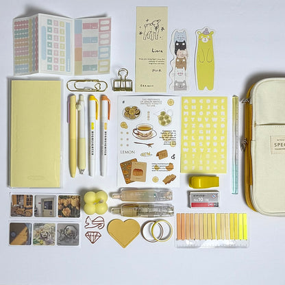 Yellow aesthetic planner and stationery set with journal, pens, stickers and pencil case
