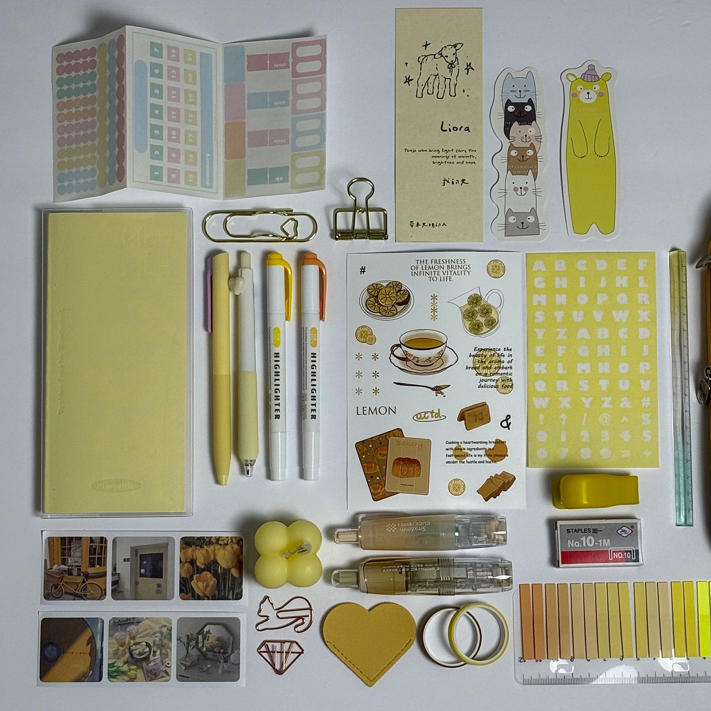 Yellow aesthetic planner and stationery set with journal, pens, stickers and pencil case