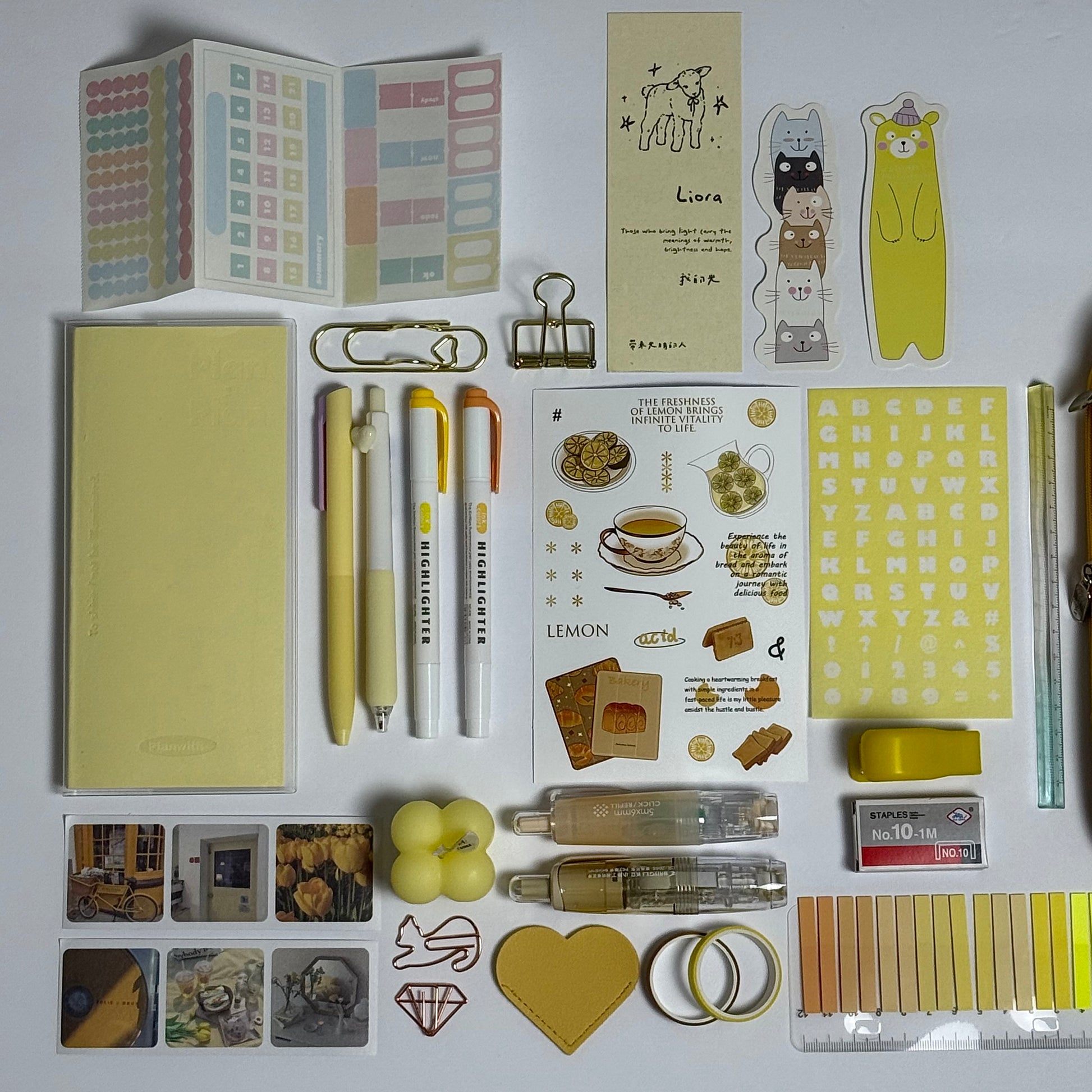 Yellow aesthetic planner and stationery set with journal, pens, stickers and pencil case