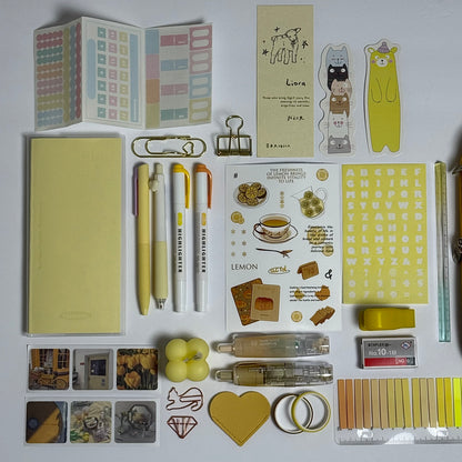 Yellow aesthetic planner and stationery set with journal, pens, stickers and pencil case